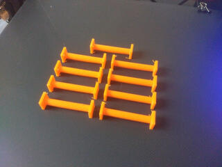 Nine bright-orange copies of the printed item, with some slight overextrusion on some corners.